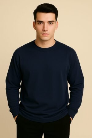 Navy blue oversized full sleeve tee with clean lines and confident posture, model facing forward.