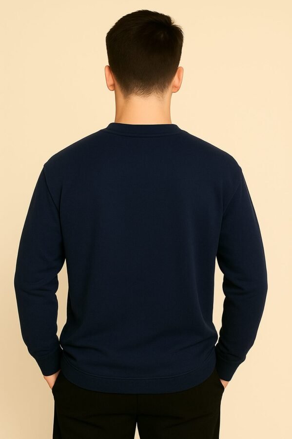 Navy blue oversized full sleeve tee with clean lines and confident posture, model facing forward.